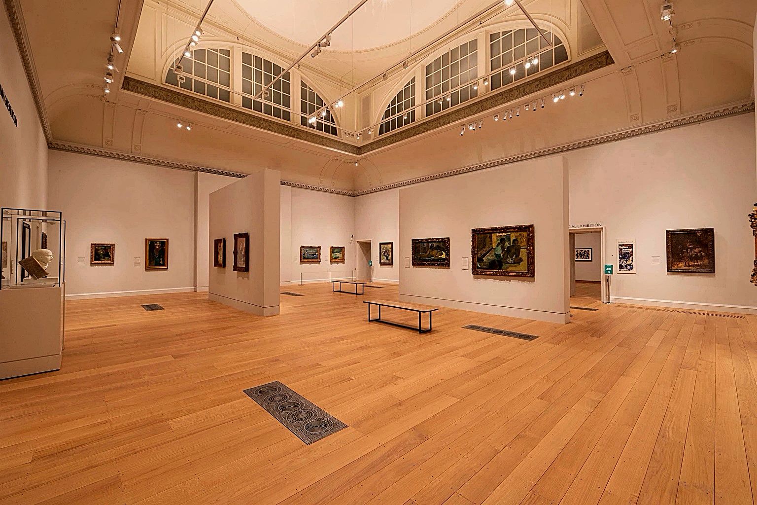 Quiet private museum gallery representing curated in-city access